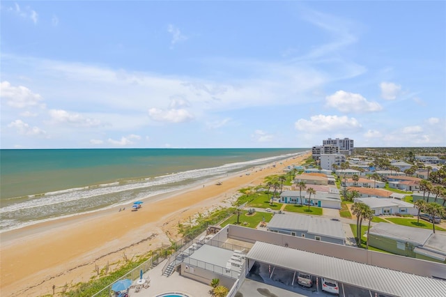 birds eye view of property with a view of the beach and a water view