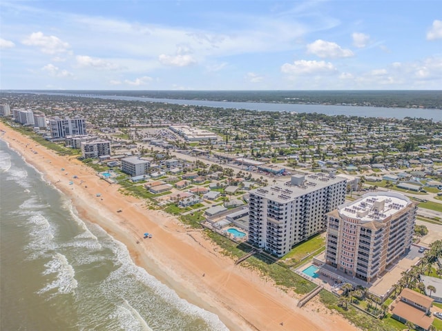 aerial view featuring a water view and a beach view