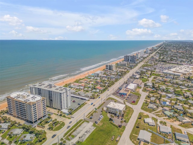 bird's eye view with a water view and a view of the beach