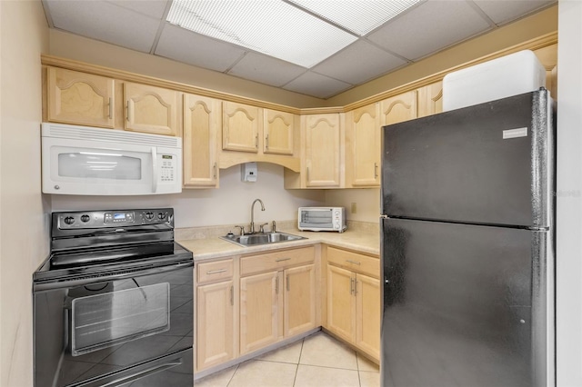 kitchen featuring sink, light brown cabinets, and black appliances