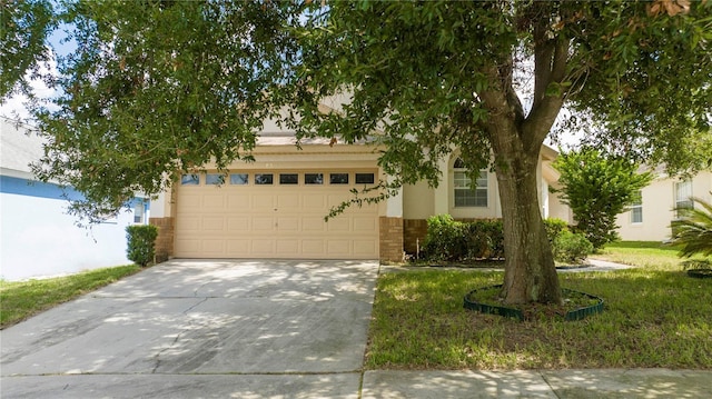 view of property hidden behind natural elements featuring a garage