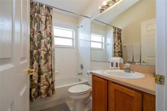 full bathroom featuring shower / tub combo, vanity, tile patterned floors, and toilet