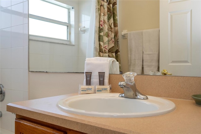 bathroom featuring vanity and a shower with curtain