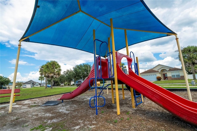 view of jungle gym featuring a lawn