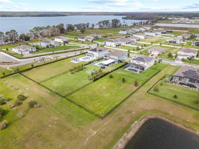 bird's eye view with a water view and a residential view