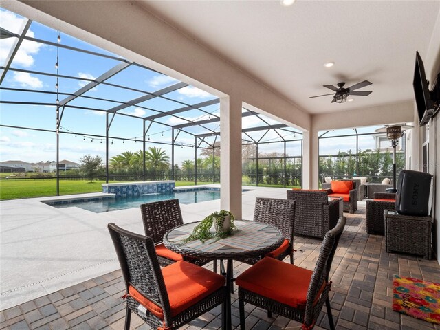 view of patio / terrace featuring an outdoor hangout area, glass enclosure, ceiling fan, and an outdoor pool