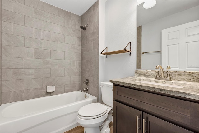 full bath featuring toilet, vanity, and bathing tub / shower combination