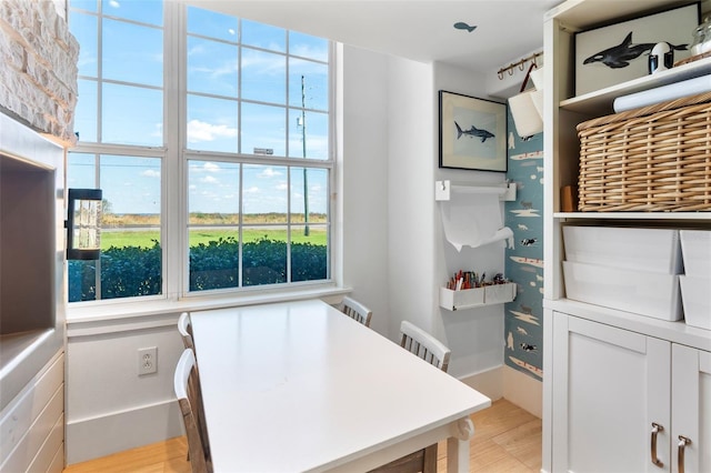 office with light hardwood / wood-style floors