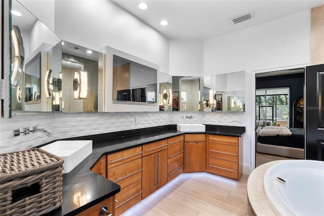 interior space featuring sink and backsplash