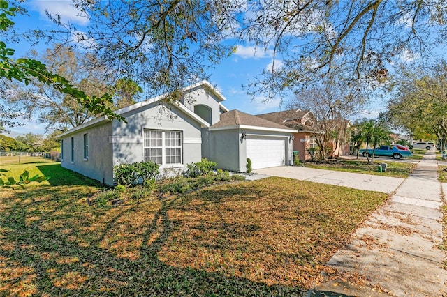 view of front facade with a garage and a front yard