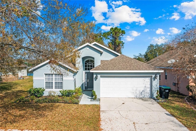 view of front of house featuring a garage and a front yard