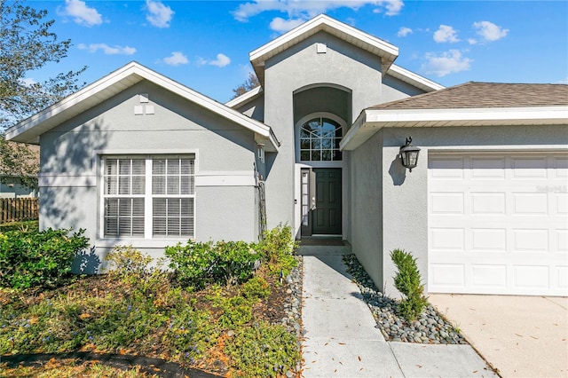 view of front of property with a garage