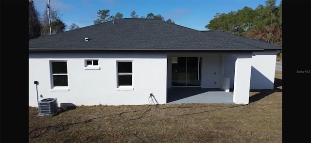 back of house with a patio and cooling unit