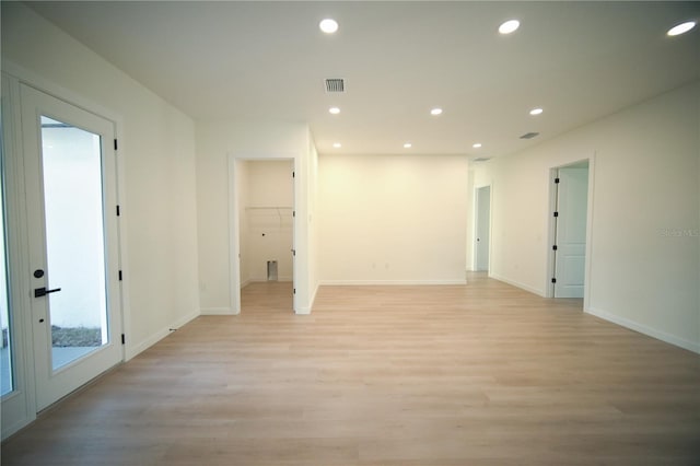 spare room with light hardwood / wood-style floors