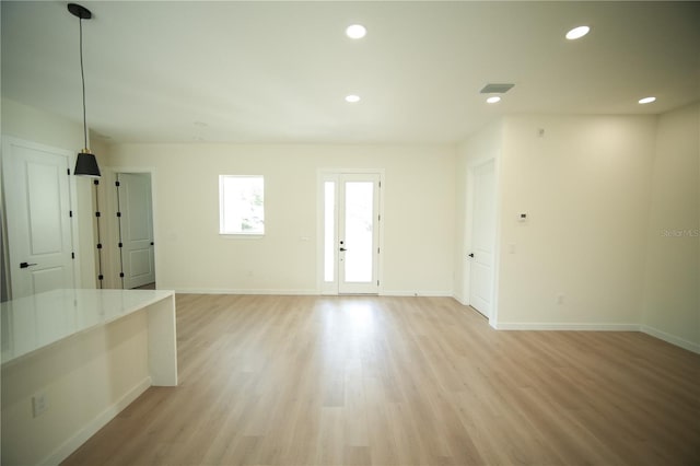 unfurnished room featuring light hardwood / wood-style floors