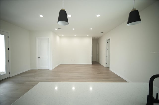 spare room featuring light hardwood / wood-style flooring