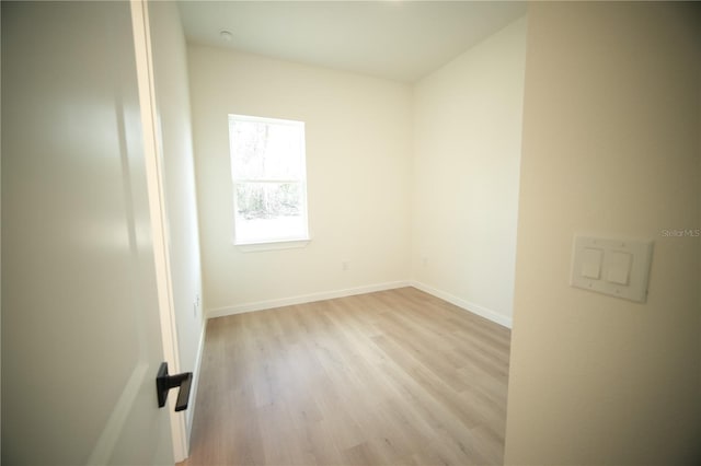 empty room with light hardwood / wood-style floors