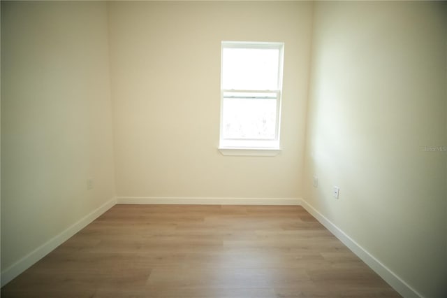 spare room with light hardwood / wood-style floors