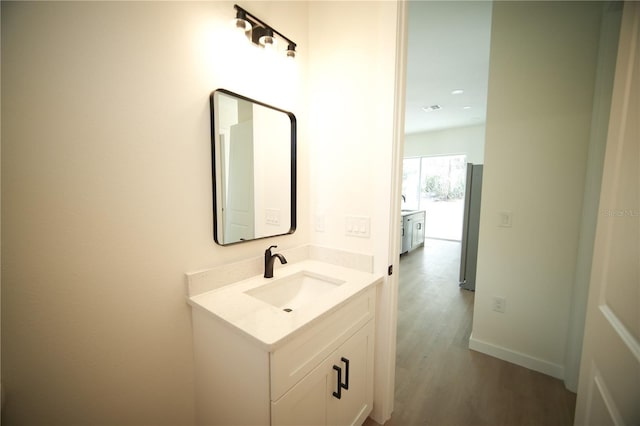 bathroom featuring vanity and wood-type flooring