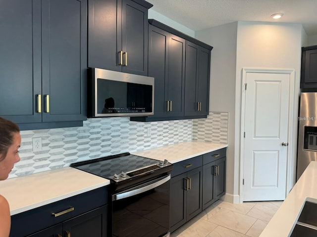 kitchen with tasteful backsplash and stainless steel appliances