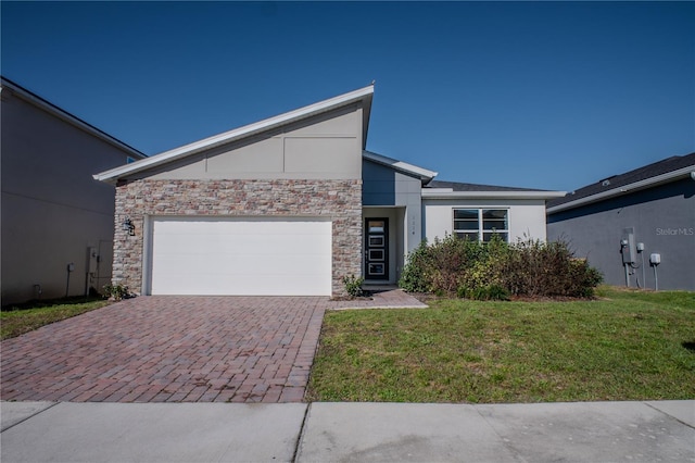 view of front of property featuring decorative driveway, stucco siding, an attached garage, stone siding, and a front lawn