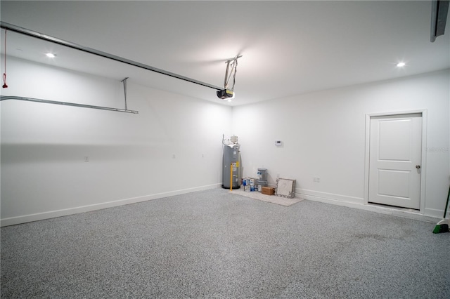 garage with a garage door opener, recessed lighting, electric water heater, and baseboards