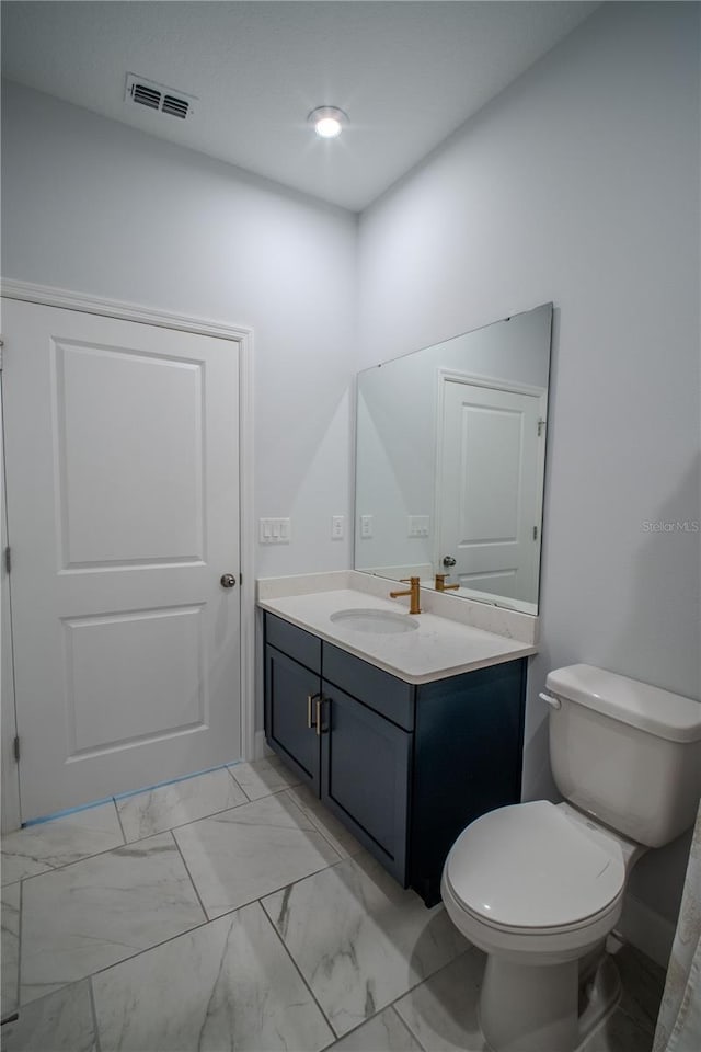 bathroom with toilet, marble finish floor, visible vents, and vanity