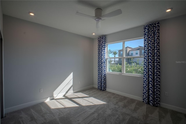 empty room with ceiling fan, recessed lighting, carpet, and baseboards