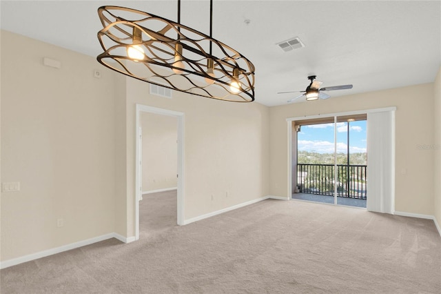 carpeted empty room featuring ceiling fan