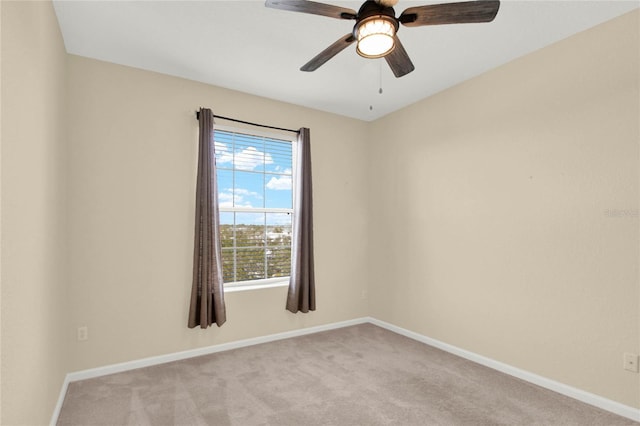 carpeted empty room with ceiling fan