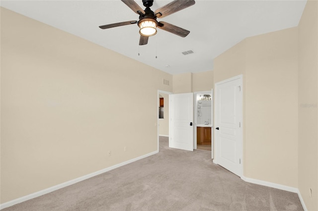 unfurnished bedroom featuring light colored carpet and ceiling fan