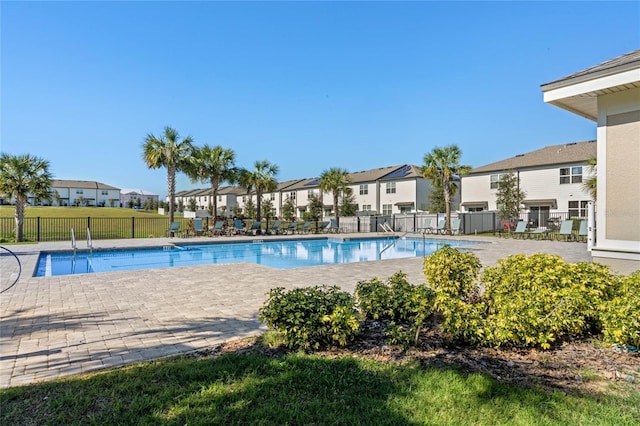 view of swimming pool featuring a patio area