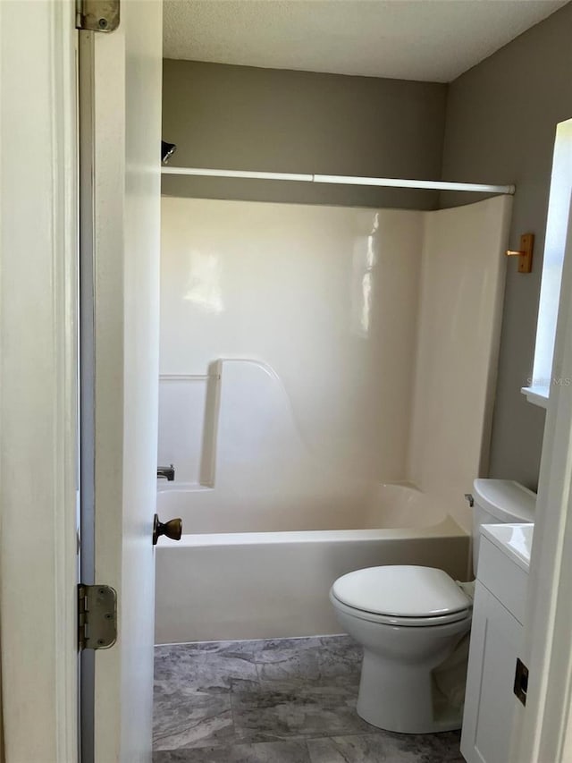 full bathroom with vanity, toilet, and bathing tub / shower combination