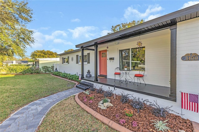 view of front of property with a porch and a front yard