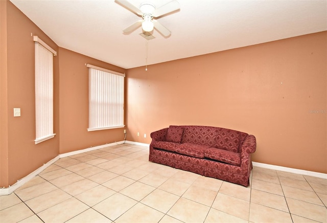 sitting room featuring light tile patterned floors and ceiling fan