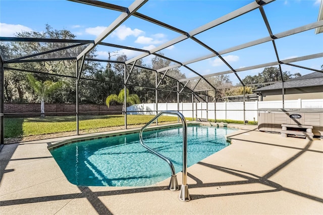 view of pool with a hot tub, a lanai, and a patio area