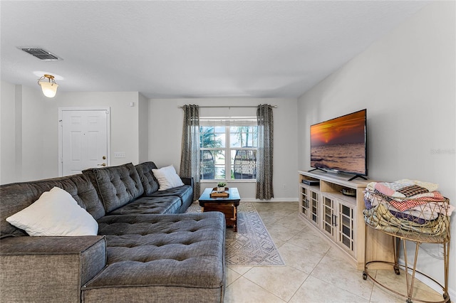 tiled living room with a textured ceiling