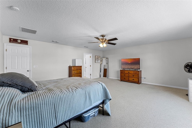 bedroom with carpet flooring, a textured ceiling, and ceiling fan