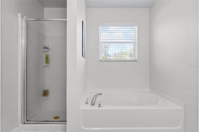 bathroom featuring plus walk in shower