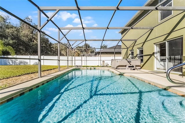 view of swimming pool with a patio, a jacuzzi, and glass enclosure