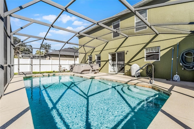 view of pool featuring a patio and glass enclosure