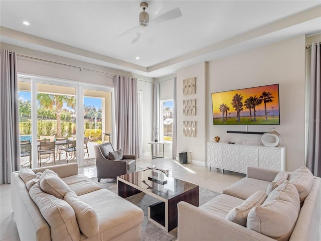 living room featuring ceiling fan and light tile patterned flooring