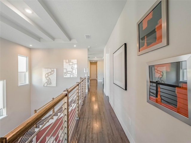 corridor with dark hardwood / wood-style flooring