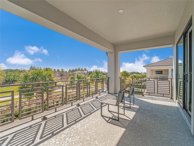 view of patio featuring a balcony