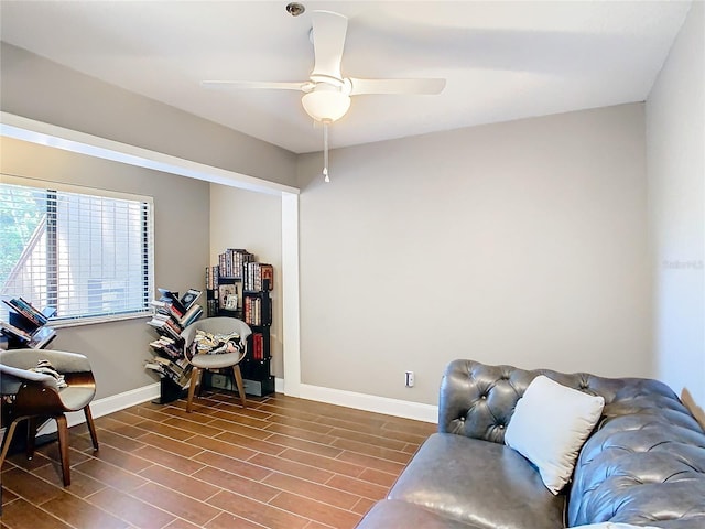 living room with hardwood / wood-style floors and ceiling fan