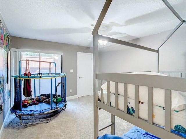 bedroom with carpet floors and a textured ceiling