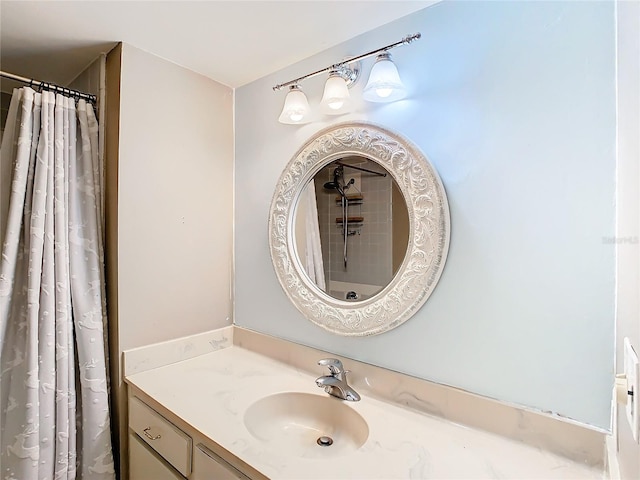 bathroom with vanity and a shower with shower curtain