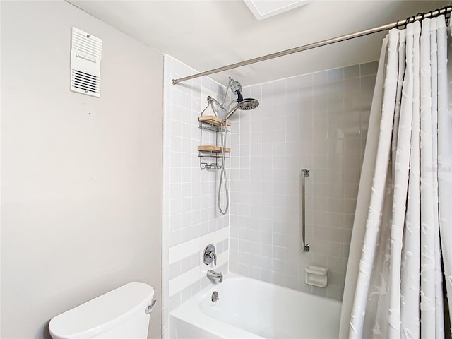 bathroom featuring shower / bath combination with curtain and toilet