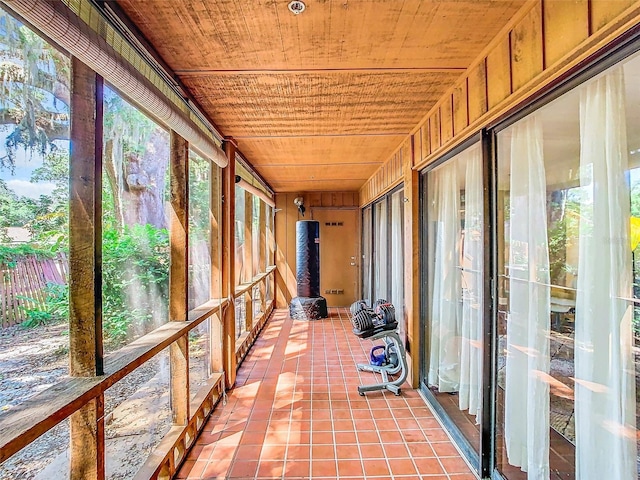 unfurnished sunroom featuring wooden ceiling