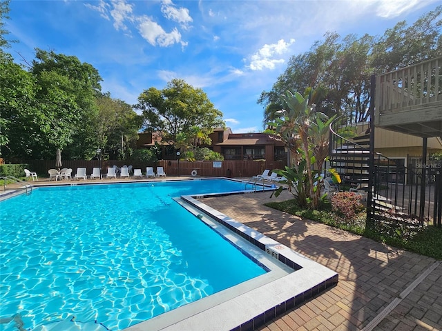 view of pool featuring a patio